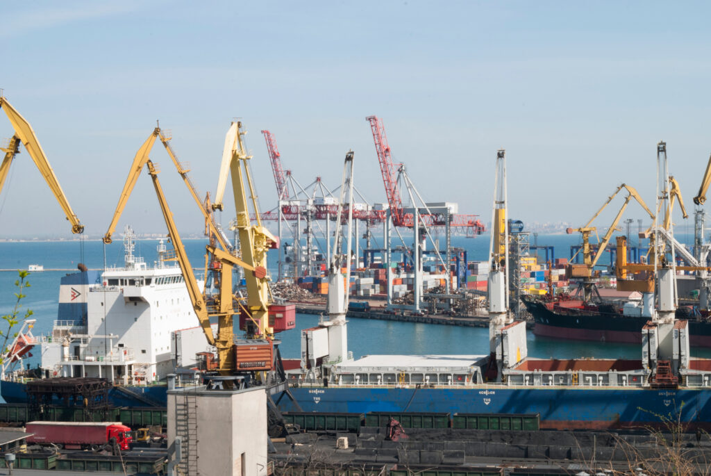 harbor cranes unload a ship