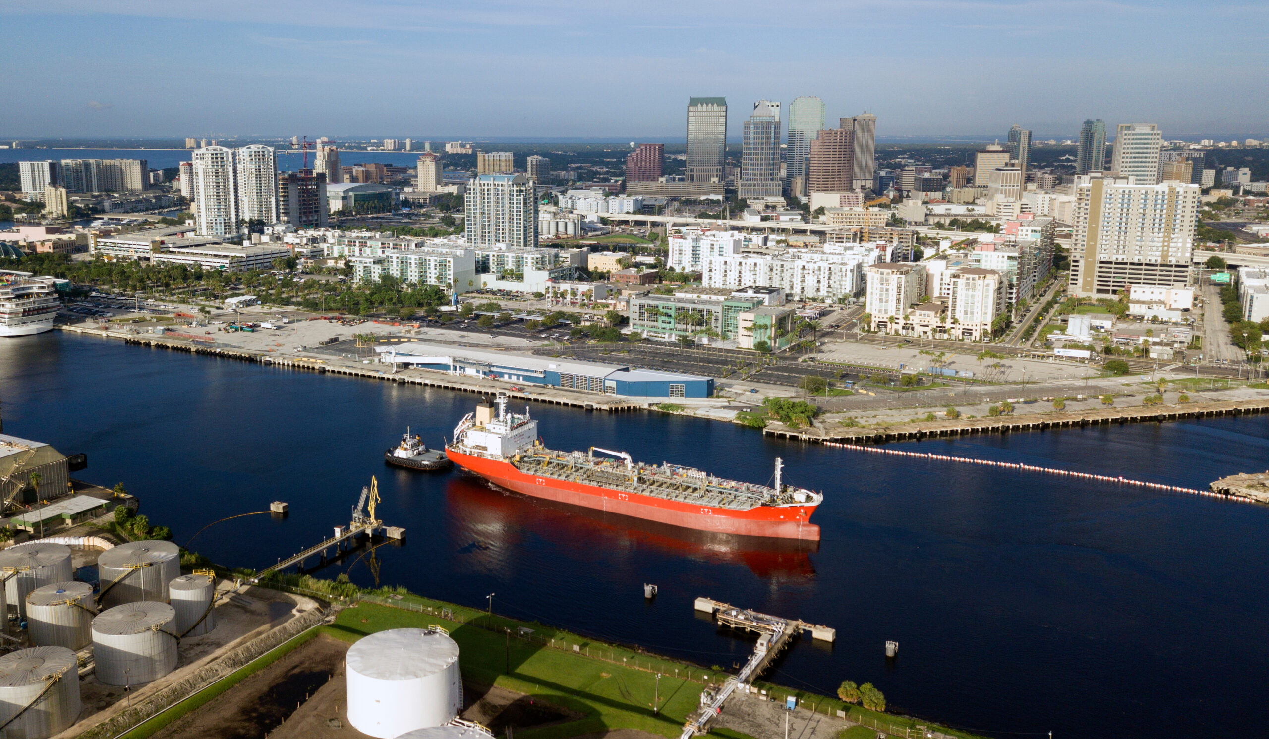 Little Tug Boats Do Double Duty Hauling Transport Ships in Port at Tampa Tampa Bay Florida has a thriving port that serves the world thru this canal and others